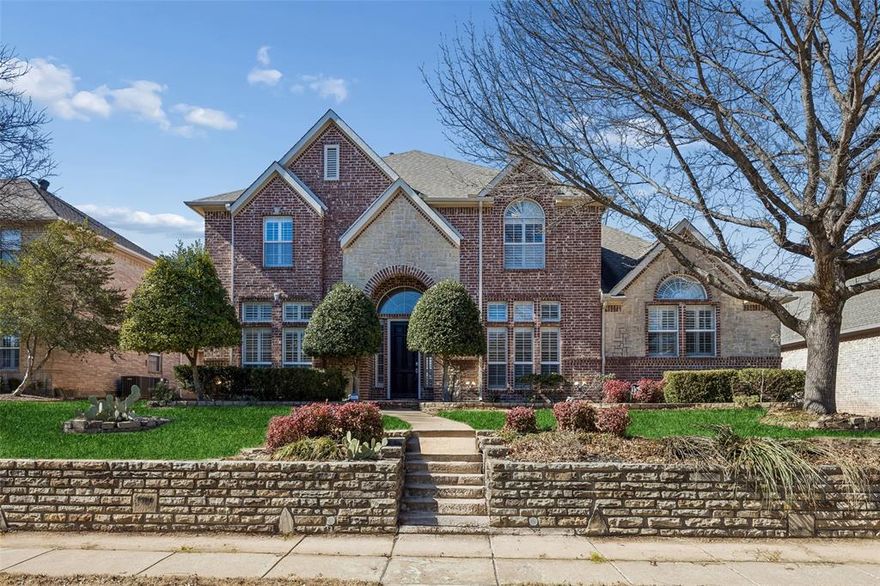 Stunning, spacious, and beautifully updated with on-trend style, this meticulously maintained home is truly move-in ready. Nestled in the highly sought-after, Woods of Springcreek, this quiet, established community offers exceptional living with abundant neighborhood features. The thoughtfully designed floorplan flows effortlessly and provides outstanding flexibility, including two dining areas and a versatile office space off the foyer that could easily serve as a third living area. The highly desirable layout includes a luxurious primary suite and a secondary bedroom with a full bath on the main level—perfect for guests or multigenerational living. Upstairs, you’ll find three generously sized bedrooms, each with walk-in closets, along with a spacious loft and an additional flex space ideal for a home office, hobby area, or extra storage. At the heart of the home, the expansive living room showcases soaring ceilings, abundant natural light from numerous windows, and a cozy fireplace flanked by custom built-ins. The chef’s kitchen impresses with ample cabinet and counter space, complemented by a stunning designer tile backsplash. The sunlit breakfast area features charming glass-front cabinetry and a custom built-in desk.  Step outside to a backyard designed for relaxation and creativity, offering a blank fenced canvas, custom pergola, and stone-style patio—perfect for entertaining or gardening. An attached three-car garage provides added storage, convenience, and security. AT&T fiber internet.  Schedule your private showing today and don’t miss this exceptional opportunity. Mortgage savings may be available for buyers of this listing.