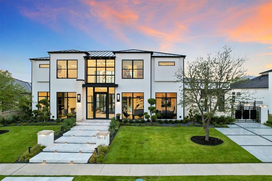 Representing the quintessential modern home in the Hills of Kingswood, Frisco, this captivating residence embodies luxury with its magazine-worthy front elevation and centered courtyard. The interior seamlessly connects all rooms with abundant natural light filtering through double-height windows and doors, creating an inviting atmosphere for indoor and outdoor entertaining.

From the grand foyer to the stylish dining room and wine cellar, each space exudes elegance. The living area merges with a sleek kitchen featuring double marble islands and top-tier Miele appliances. The master suite boasts opulence with pool views, a marble-clad bathroom, and an impressive dressing room reminiscent of luxury designer Tom Ford.

Additionally, the fabulous upper-level game room features a wet bar and a gym, along with striking theater seating, a 7.1-certified THX media room. The entire house is equipped with multiple TVs, audio, video, security cameras, lighting & motorized shades. The resort-style outdoor area includes a pool, spa, outdoor kitchen, fireplace, firepit area, and a fantastic turf yard, making it ideal for large-scale entertaining.

Situated within a 24-hour gated guard community, this modern masterpiece is just minutes from Plano's corporate headquarters, Legacy West, The Star, PGA, and Universal Studios. This home offers the ultimate in luxury and exceptional design within a serene setting.