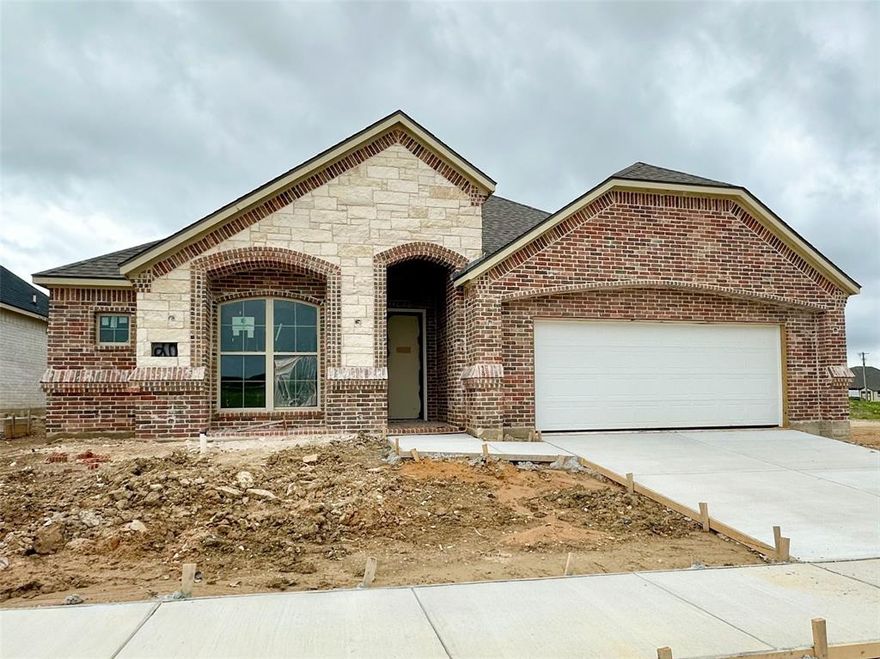BUILDER NOW OFFERING $7500 TOWARDS BUYERS INCENTIVES!! This beautifully crafted home has a large open kitchen custom cabinetry with 42in uppers large granite island with undermount 50 50 sink and concealed trash cabinet. The stainless Whirlpool appliances make this kitchen a chefs dream Elevated ceilings with double crown molding in living area single stage in kitchen, dining, entry and primary. Oversized 5.25 baseboards throughout. Ceiling fans with light in living and primary, guest bedrooms are wired as well. Luxury water resistant vinyl plank flooring in the main areas and hallway. Full security system. The grand entry way opens into the nice living room featuring large glass sliding door. Energy efficient windows throughout. Primary bathroom has fully tiled showers with accent flooring. The exterior is beautifully designed with brick and decorative stone. An insulated 2 car fully finished garage has neatly textured walls and baseboards. Encapsulated foam insulation for highest energy efficiency. A full sprinkler system landscaping with 2 trees as well as the nice size backyard.