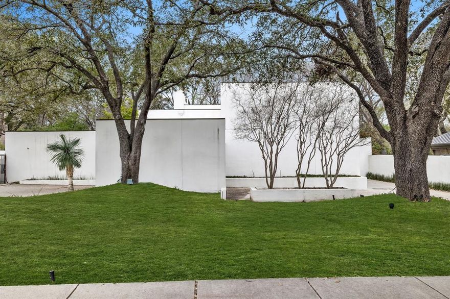 Welcome to this striking contemporary home, where incredible style meets modern living. Personally owned by local interior designer, step inside to find open living, dining and entertaining spaces flooded with natural light from walls of windows showcasing a wooded creek view. The recently updated chef's kitchen boasts gorgeous quartz countertops and backsplash, Thermador range, refrigerated drawers and a curated custom built-in kitchen table. The main level also features a private office and guest suite. Head upstairs to the oversized primary retreat with ensuite bath and sizable closet. Two additional bedrooms and an incredible family room with a kitchen area and sunroom complete the upstairs. Outside, you'll find an outdoor oasis perfect for al fresco dining and dipping in the sparkling pool. Three car garage and circular drive. This sleek residence presents an excellent opportunity for sophisticated and luxurious living.