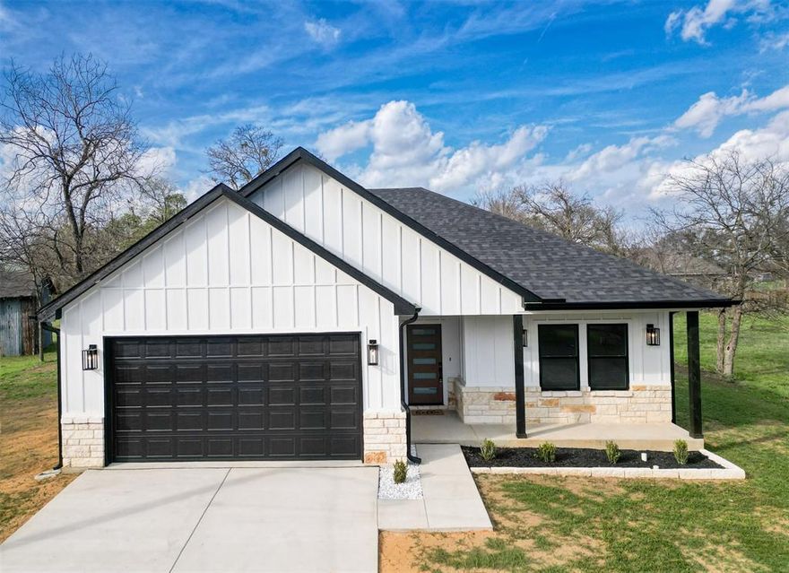 Welcome to this stunning brand-new construction home in Cleburne offering modern finishes, thoughtful upgrades, and quality craftsmanship throughout. This beautiful 3-bedroom, 2-bathroom home was designed with both comfort and style in mind.
Step inside to an inviting open-concept layout featuring custom-built cabinetry, elegant Calacatta Ajax quartz countertops, and a spacious kitchen perfect for entertaining. The kitchen is highlighted by a 33-inch farmhouse sink, stylish pendant lighting, an air fry range, and beautiful under and over cabinet lighting that creates a warm, modern ambiance.
The home features recessed canned lighting throughout, durable siding, and detailed 6-inch trim that adds a refined touch to every room. The primary suite offers a relaxing retreat with a vaulted ceiling and a beautifully designed custom shower.
Additional features include spray foam insulation for energy efficiency, Cat 6 high-speed internet wiring, and bright flood lights for added security and convenience. The property also includes a fully finished garage, 6-inch gutters, a convenient linen closet and coat closet, and carefully selected modern finishes throughout.
Located in a growing area of Cleburne, this move-in-ready home offers the perfect balance of modern construction, thoughtful upgrades, and small-town charm while still being within reach of the Dallas–Fort Worth metroplex.