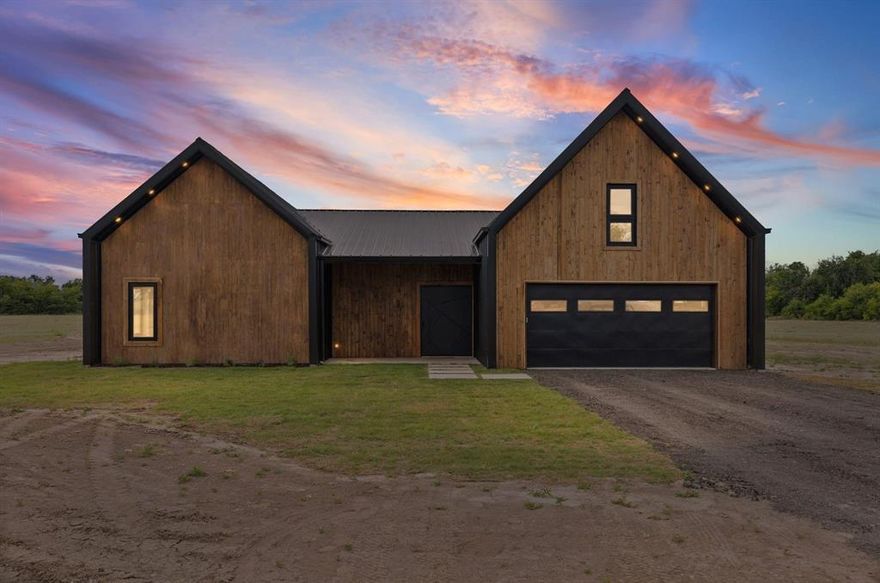 NEW BUILD - READY TO ENJOY is this very spacious 4 Bedroom 4 Bath custom built barndominium with 9 acres located on a peaceful county road. This home features special builders touches from front to back with custom built entry and gates, micro cement flooring, custom cabinets, quartz countertops and much more!
 As you enter the extra wide vault type front door you find wide accessible hall leading to the large living area with cathedral ceilings, stained trim  and a dry bar. The custom kitchen features include an island, beautiful cabinets, quartz countertops and huge (6.5x13) walk-in pantry that has custom shelves and a sink. The large custom built windows along back of the dining area allows you to enjoy the natural lighting. Outside you will find a large covered entertainment area that could feature an outdoor kitchen, table, pool, hot tub and providing plenty of space for all if desired. The large (15x16) primary bedroom has custom bath, shower, quartz countertops and a walk-in closet with custom shelves and shoe rack. The second large bedroom also has a custom closet. The other two bedrooms have their own bath with shower. Upstairs you will find a large (28x18) game room with bamboo flooring and providing plenty of space for your imagination. Added to the floorpan as a bonus is a custom built (8x8) safe room. (Not on floorpan)
This home was designed and built with ownership in mind with spray foam insulation, easy upkeep features, all plumbing downstairs, large rooms, custom touches throughout, gated entry and about anything you could ask for in a new home. The 9 acres offers plenty of space with tree lined boundaries for extra privacy. There is plenty of room for a shop, barn, garden and animals to enjoy your NEW home with that peaceful country life. 
This amazing home is also avaiable on 3 or 6 acres to fit the buyers needs.