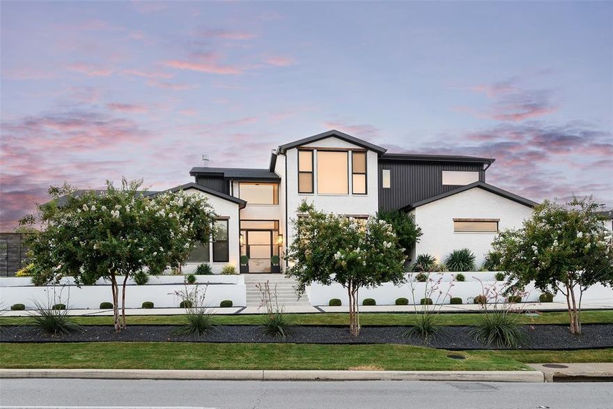 Set on an elevated lot with circle drive in Preston Hollow, this ARK Studio designed home was completed by Third Street Custom Homes circa 2021 blending modern elegance and effortless comfort.  The light-filled transitional residence spans 4,984 sqft and is designed for both grand entertaining and everyday living. Wide-plank hardwoods, Porcelanosa tile, soaring ceilings, and walls of glass set the stage for designer finishes, thoughtful upgrades and deft execution throughout. Step into the dramatic living room, where 24-foot ceilings and a sleek gas fireplace are framed by sliding glass doors that open to a 560 sq. ft. screened patio, resort-style pool, fire pit, and turfed backyard. The dining room, complete with a wet bar and wine fridge, flows seamlessly into the chef’s kitchen—an entertainer’s dream featuring a large island with breakfast bar, Dacor 6-burner gas range, Monogram microwave and dishwasher, double ovens, Signature Kitchen Suite refrigerator and freezer, trash compactor, and an oversized walk-in pantry with a Whirlpool refrigerator and freezer combo. The primary suite is a private retreat with an updated spa-like bath and a custom walk-in closet that includes direct access to the utility room with sink. Additional first-floor amenities include a guest suite, private study, media room with built-ins and bar, family room, mudroom, and a full bath perfectly positioned for poolside guests. Upstairs, two spacious bedrooms with en suite baths and generous storage offer comfort and privacy. A three-car garage with additional half-circle drive, storm shelter, lush landscaping, and custom motorized shades throughout complete this truly turnkey property. Seamlessly balancing luxury, function, and style, this home is as practical as it is breathtaking - ready to elevate daily living into something extraordinary – all set in one of Dallas’ most sought-after neighborhoods - close to Dallas’ top schools, shopping and dining.