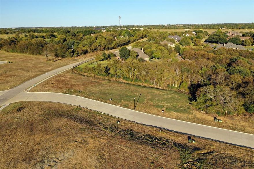 Rare opportunity to build your custom luxury estate in the highly desirable Heritage Crossing community in West Sherman. This premium lot is perfectly suited for a new  home and offers the freedom to bring your own builder with no PID or MUD — keeping your investment focused on quality and design, not unnecessary fees. Heritage Crossing features oversized lots, mature trees, and elegant streetscapes, offering the privacy and space luxury buyers expect. Ideally located just minutes from US-75, you’re close to the expanding TI and GlobiTech campuses, upcoming retail and dining at Sherman Crossroads, and future development at Heritage Ranch. Zoned to sought-after S&S schools and within reach of the new Sherman High, this is the perfect setting for families looking to invest in both lifestyle and long-term value. All utilities are in place with completed infrastructure and final plat approved — ready for you to start building your dream home. With demand rising and limited premium lots available, don’t miss your chance to secure this exceptional homesite in one of Sherman’s fastest-growing and most prestigious neighborhoods.