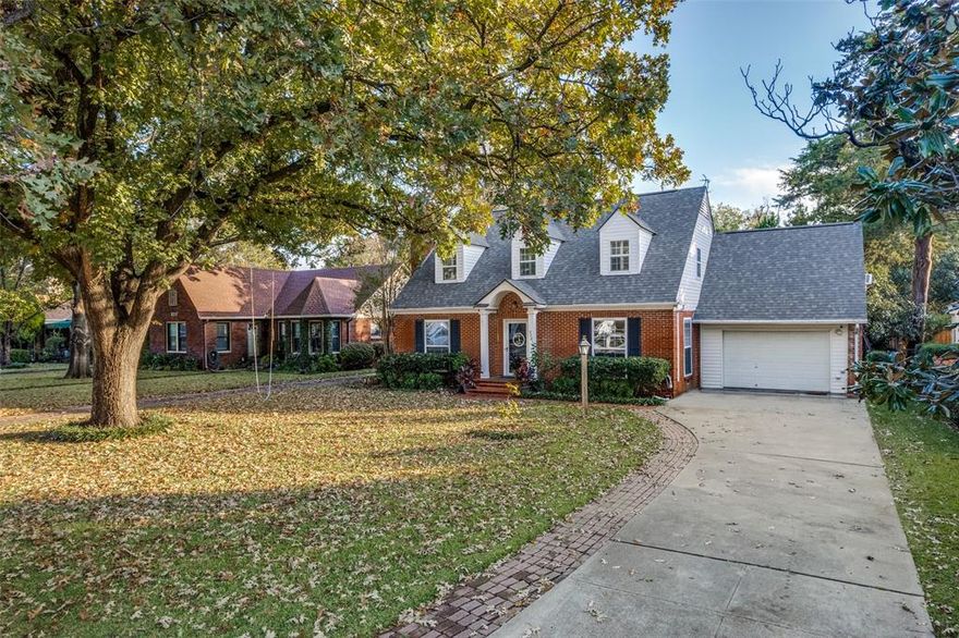 Charming 1940's home in the highly sought-after Bellaire Addition with just a short walk to the TCU campus.  This classic two-story home offers exceptional curb appeal highlighted by a beautiful mature oak tree that anchors the front yard.  Step inside to discover original hardwood floors with built-ins throughout that give a warm and inviting feel. The living room features a cozy gas fireplace, perfect for relaxing evenings, while the adjoining dining area with amazing chandelier continues the home’s lovely character.  Numerous windows throughout the home let in an abundance of light.  The spacious eat-in kitchen is designed for both function and style, offering granite countertops, 42-inch cabinets with a wooden planked ceiling and wall paneling that add to the interest of the space with plenty of room to gather.  Three oversized bedrooms with enough room for a sitting area in each. One large bedroom downstairs and two upstairs give this layout wonderful flexibility.  Two cedar closets provide excellent storage for your most cherished items.  Additional room upstairs with built-in desk and shelving, perfect for office, craft room or children's study area.  Thru the 3rd bedroom there is a bonus room with unlimited possibilities: create a 4th bedroom, playroom, closet dressing area, or generous walk-in storage space.  One of the Seller's favorite things is to sit and relax on the screened-in back porch, which overlooks the expansive backyard, complete with rich St. Augustine grass.  The huge backyard is ideal for entertaining, gardening, or simply enjoying peaceful outdoor moments.  Blending historic beauty with modern comforts, this Bellaire Addition gem is the perfect opportunity to own a lovingly maintained home in one of Fort Worth’s most desirable neighborhoods.