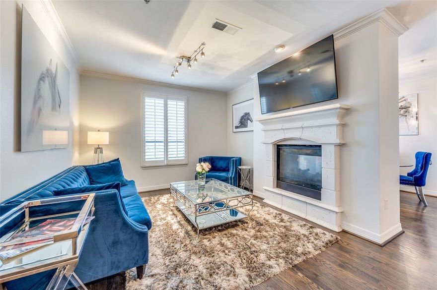 Enter the elegant life of condominium living via this upgraded 2-bedroom, 2.5-bathroom home. Abundant natural light floods the west-facing, 1406 sq. ft. floorplan suited for relaxation and entertainment. High ceilings and beautifully crafted hardwood floors introduce the cozy living and dining spaces, married by a charming double-sided fireplace. Sophisticated pendant lights accent the largest of The Sorrento kitchen islands, and recently added cabinets offer generous storage. Stainless steel appliances, including a wine fridge, a new refrigerator, and upgraded designer tile, complete the surprisingly large kitchen. Each bedroom offers its own en-suite bathroom, walk-in closet, and generous dimensions. The spacious primary bathroom offers a tub with a separate shower and an accommodating walk-in closet. Outside, a sleepy neighborhood view is offered on the covered, tranquil balcony with ample green and seating space. This residence also includes two designated garage parking spaces and a secured space for bikes. Two building entrance options include the main foyer and a secondary, more private back entry. Residents enjoy a lifestyle enriched by a community deck, an infinity pool, downtown views from the 5th-floor terrace, and a state-of-the-art fitness center. The meticulously maintained surroundings provide a serene escape, yet is minutes from popular shopping and entertainment destinations.