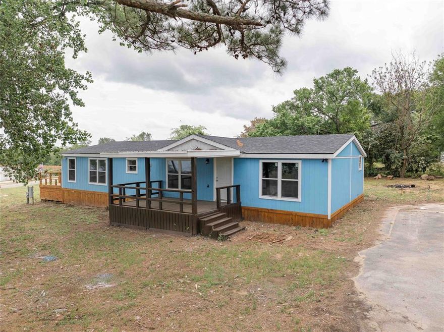 Escape to tranquility in this 3 bedroom, 2 bath double - wide, located in a desirable gated community on Callender Lake.  This is not just a remodel, it is a transformation designed for modern comfort with picturesque water views!  Step inside to discover a bright , open concept floor plan featuring brand new flooring throughout, updated kitchen cabinets, and updated bathrooms.  Feel secure and comfortable with total peace of mind knowing the home features new exterior siding, a new roof, new electrical, new plumbing, new windows, and a brand-new HVAC system for year-round comfort.  Enjoy the serenity of gated living with beautiful water views right from your property on three large porches.  This home offers a great retreat for lakeside leisure as your full time home or weekend getaway.  This 1680 sq. foot home is located on two lots with .344 acres in the gated community of Hickory Hills located on Callender Lake.  The community has a community pool, boat ramp, fishing pier, restroom and shower facility (by the pool), lake swim area, children's park, and so much more for your enjoyment.  Come see this property today.