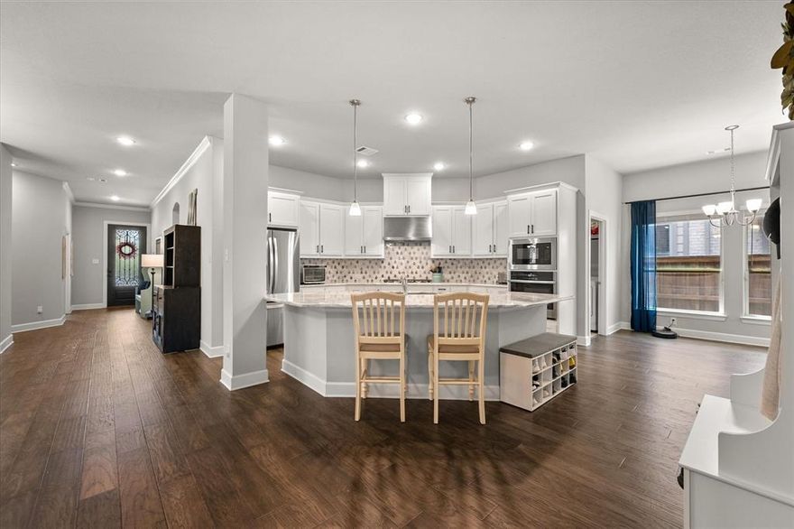 Located in one of Arlington’s most sought-after communities, this beautifully designed 3-bedroom, 2.5-bath home offers the perfect balance of comfort, elegance, and everyday convenience. Thoughtfully updated with high-end finishes, it features a dedicated home office, sleek upgraded bathrooms, and a spacious two-car garage. The bright and airy floor plan flows effortlessly, with a large living area anchored by a cozy fireplace—perfect for relaxing or gathering with family and friends. At the heart of the home is a chef’s kitchen, boasting an oversized island, marble countertops, premium appliances, and generous prep space. The primary suite serves as a peaceful escape, complete with a luxurious ensuite bath, separate walk-in shower, dual vanities, and spa-inspired details. Two additional bedrooms provide flexible space for family, guests, or hobbies. Step outside to enjoy a covered patio and private backyard—ideal for quiet mornings with a cup of coffee or unwinding after a long day. Set within the highly desirable Viridian community, residents enjoy access to top-tier amenities such as resort-style pools, scenic trails, tranquil lakes perfect for paddleboarding and kayaking, and lush parks. The neighborhood also features its own elementary school, tennis and sand volleyball courts, and a community amphitheater that hosts seasonal events and gatherings. With a prime location just minutes from DFW Airport, AT&T Stadium, Globe Life Field, and the vibrant Texas Live! entertainment district, this home offers the ideal lifestyle for those who want to stay connected while enjoying the serenity of a well-planned neighborhood.