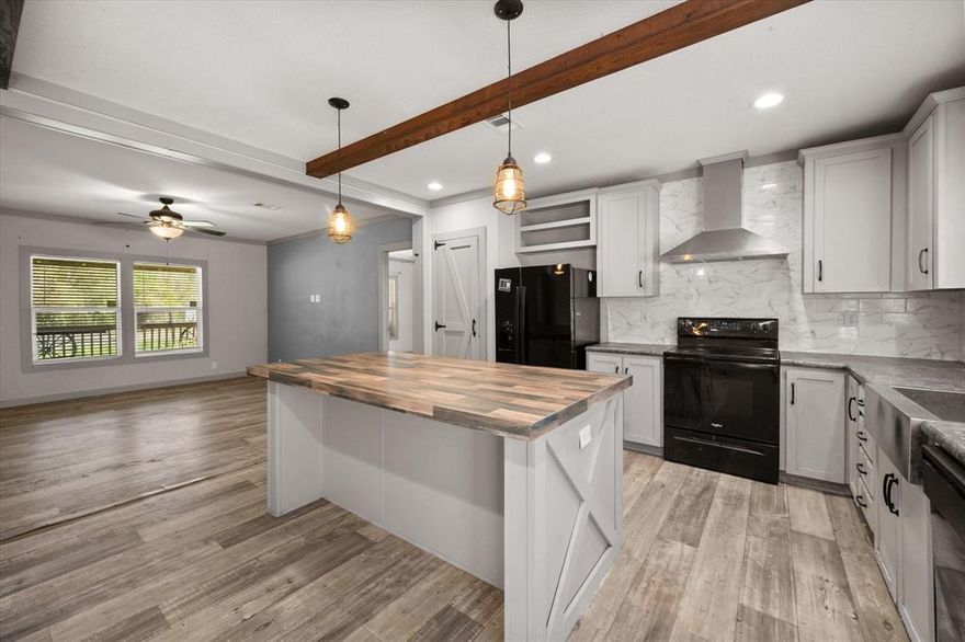 Welcome home to this charming 3-bedroom, 2-bath property located in Eustace ISD! Designed with both style & functionality in mind, this home features an open-concept layout perfect for everyday living & entertaining. The farmhouse-inspired kitchen showcases a spacious island, modern finishes, & eye-catching lighting, all flowing seamlessly into the large living area—great for gatherings. The dining area is conveniently located within the kitchen, making hosting family & friends effortless & enjoyable. The primary offers a relaxing retreat with an ensuite bath featuring dual sinks, a garden tub, & a separate shower. 2 additional bedrooms share a well-appointed hall bath, providing comfortable space for family or guests. Step outside & enjoy the standout features, starting with the beautiful custom-built natural wood front porch. Fully covered under the roof overhang & spanning the entire front of the home (approx 15x40), it’s the perfect place to relax & unwind. The back porch (10x12) offers additional space for outdoor enjoyment, whether you're sipping your morning coffee or hosting a backyard gathering. The property includes 2 large custom-built sheds (approx 20x16 & 15x16), both powered & secure, ideal for storage, a workshop, or even conversion into a home office, hobby space. Situated on 2 lots, this home features a spacious 100x100 fully fenced backyard, perfect for pets to run freely, along with a large front yard. Altogether, the property gives you room to spread out & enjoy. As part of Cherokee Shores Assoc, ownership includes access to an impressive range of amenities on Cedar Creek Lake. Enjoy lake access on both sides of the lake, one being just a short 5-minute walk from the home. Access to a swimming pool, clubhouse, lakeside park, tennis court, private dock, & the convenience of a daily free trash compactor drop-off. This home blends modern touches with cozy charm, plus unbeatable outdoor space & community perks, ready for you to make it your own!