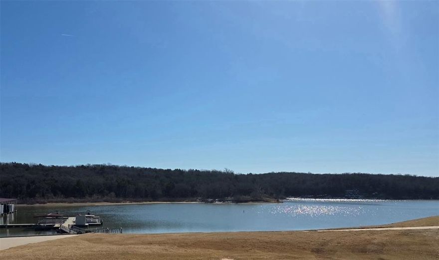 Reflection Bay is one of the last additions in Rock Creek to be developed and one of the closest to Lake Texoma.  Reflection Bay is currently a beautifully wooded area and all lots are within few minute walk to lake, marina and trailhead making it easy to enjoy views and these amenities anytime of the day.  It is short drive by car or golfcart to the Jack Nicolas designed course, Rock Creek clubhouse, restraunt, workout center, pool and sports courts. In addition to lot 10, lot 11 is being sold by Seller's relatives so you can buy one lot and get friends or relatives buy the other to ensure you are side by side OR you can buy both and build one home on both lots for larger yard or privacy.  Memberships to golf club vary and information on options should be obtained directly from Rock Creek Resort. Rock Creek Resort is 1300 acre, gated community on the shores of Lake Texoma and made up of both full-time and part-time residents.  You can see photos and video of the resort on their website.