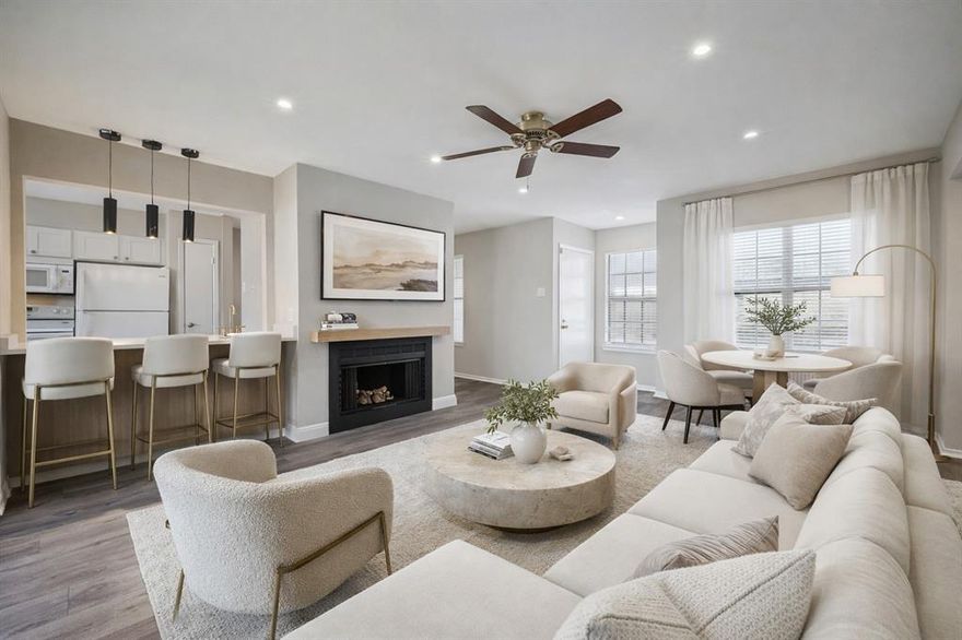 Welcome to the desirable gated community of Bent Tree Forest Condos ideally located in North Dallas surrounded by mature trees and beautifully maintained green space. This prime location offers exceptional convenience just minutes from the North Dallas Tollway, I635 and the George Bush Tollway placing shopping, dining and entertainment options within easy reach. Residents enjoy amenities including a swimming pool with heated spa, clubhouse, tennis courts and landscaped grounds with mature trees providing a tranquil setting to relax and enjoy the outdoors. The HOA maintains the landscaping and amenities creating a low maintenance lifestyle. Step inside this freshly painted and renovated condominium featuring luxury vinyl plank flooring throughout the main living areas and kitchen. The formal dining area provides a welcoming space for entertaining family and friends. The spacious living room is highlighted by a cozy wood burning fireplace and built in  wet bar area with quartz countertop perfect for hosting gatherings or relaxing at the end of the day. The remodeled kitchen features painted cabinetry, quartz countertops and a functional layout designed for everyday living. A door with storm door opens to the private balcony where you can enjoy peaceful views overlooking the surrounding green space. The guest bedroom offers comfort and privacy with a walk in closet and ceiling fan. The remodeled guest bathroom features quartz countertops, built in cabinetry, tub shower combination and linen closet for additional storage. The primary bedroom is generously sized and includes two walk in closets. The remodeled en suite bath offers built in cabinetry including a makeup vanity area with quartz countertops and tub shower combination. Washer, dryer, refrigerator and the living room television will convey with the sale. Two assigned parking spaces included with the property space 388 covered and space 391 uncovered. HOA also includes water, trash, heating and sewer.