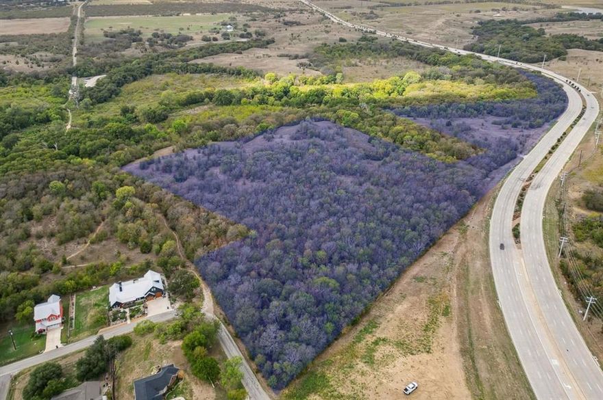 Discover a rare and remarkable opportunity to create your legacy estate on this expansive 17.31-acre homesite, ideally positioned along a prominent corridor in highly sought-after Flower Mound. Just minutes from the North Shores of Lake Grapevine and DFW Airport, this exceptional property offers the perfect balance of accessibility, seclusion, and natural beauty. Tucked behind heavily wooded Lake Grapevine Corp land, the setting is nothing short of breathtaking—offering peaceful privacy, scenic vistas, and frequent sightings of native wildlife. With ample room to design a true showplace, envision a grand residence, resort-style outdoor living, equestrian elements, or a custom workshop—all tailored to your vision. Adding to its long-term appeal, this premier location lies on the coveted west side of Flower Mound, home to the highly anticipated Furst Ranch master-planned development—a transformative, world-class destination set to bring an unmatched collection of upscale retail, dining, medical facilities, and luxury hotels just moments away. Future infrastructure improvements, including the planned expansion of Highway 377, will further enhance connectivity, providing seamless access to Westlake, Southlake, and Downtown Fort Worth. Located within the prestigious Flower Mound Cross Timbers Conservation District and zoned to highly regarded Argyle ISD, this property combines exclusivity with top-tier education. With land becoming increasingly scarce in Flower Mound, this is a compelling opportunity for discerning buyers, builders, or developers to secure a truly exceptional piece of North Texas.