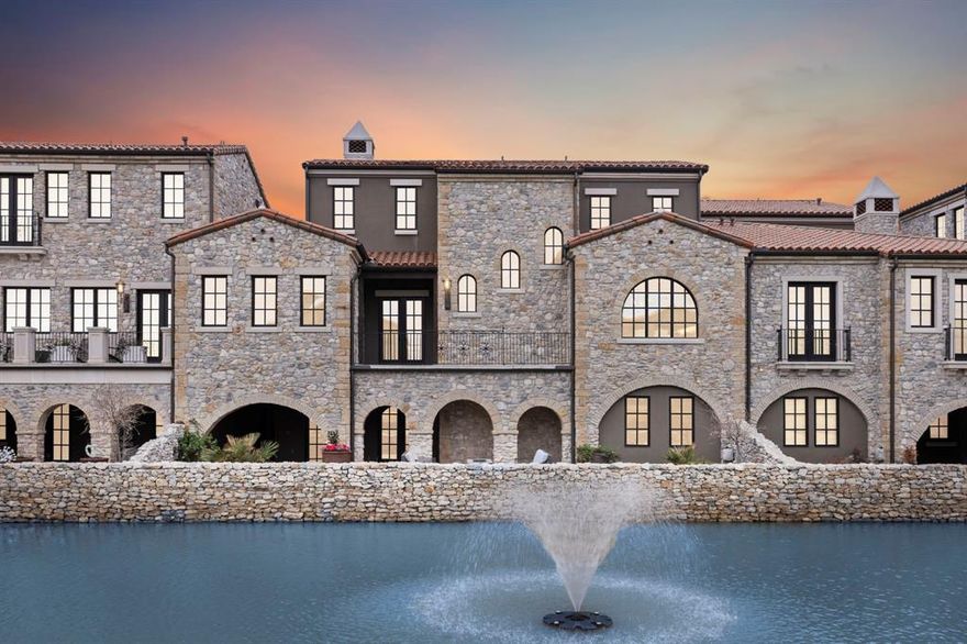 Exquisite Spanish-architectural townhome located in the coveted Westlake Entrada-a walkable community modeled after a Catalonian village.  This spectacular waterfront home boasts 4,226 sf, perfectly distributed throughout three luxurious levels with stunning canal views!  The primary suite is conveniently located on the main level which also enjoys a light-filled open floor plan, oversized windows, elevator, EV charger, commercial-grade appliances, dedicated office, large utility room and a charming balcony overlooking the tranquil canal.  The second floor is very private with only two guest rooms and ensuite baths. The lower lever is perfect for entertaining with a large game room, wet bar, media room, full bath and an additional guest bedroom with private access to the covered waterfront veranda.  Westlake Entrada is a charming lock and leave community with dining and shopping amenities. Amazing school options include Carroll ISD and the International Baccalaureate Westlake Academy.