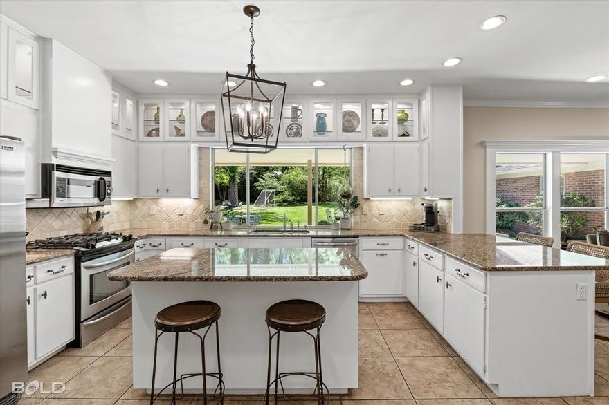 Stately home in sought after Pierremont Acres! This exquisite property boasts 4 bedrooms and 3 FULL baths including a desirable mother-in-law or guest suite. Step inside to discover an inviting open floor plan, accentuated by stunning granite countertops, custom kitchen cabinetry and the timeless elegance of earthy tones throughout. The main living room is centered around a wood-burning fireplace and custom crafted entertainment center.  There's an additional formal living room in the front of the house. The bedroom layouts include a Jack and Jill bathroom connecting the two bedrooms. The master suite is a true retreat with bedside sconce lighting surrounded by an exquisite window alcove and tailored entertainment center. RARE opportunity to own a home on such a spacious lot, covered back patio, and open floor plan making this a true entertainer's paradise.  You will love the abundance of character, ample storage spaces, and fine wood craftsmanship throughout.