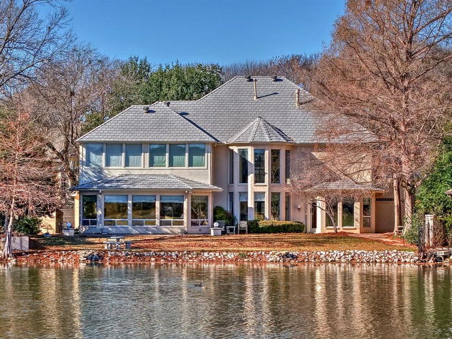 Designed for effortless entertaining and everyday luxury, this gracious home offers expansive living spaces enhanced by breathtaking views of the lush golf course and tranquil lake. The chef’s kitchen flows seamlessly into a spacious second living area, where dramatic floor-to-ceiling windows flood the space with natural light and create a stunning indoor-outdoor connection. The primary suite is a private retreat featuring panoramic water and fairway views, a spa-like en suite bath with dual vanities, a soaking garden tub, and an oversized walk-in closet. Upstairs, three generously sized bedrooms and an additional living area or optional fifth bedroom continue to capture the home’s remarkable vistas. Blending elegance, comfort, and functionality, this exceptional residence delivers a rare opportunity to enjoy refined living framed by serene, picturesque surroundings.