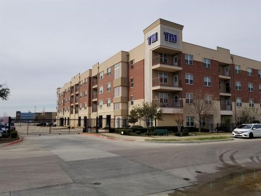 Beautiful, spacious and well maintained condo in Carrollton. Gated community. Interior hallways with keypad entry to units. Conveniently located off the highway I-35, TX-121 and George Bush Turn pike  and across street from shopping & entertainment. Open & bright with 2 split bedrooms, 2 full baths and a flex area that can be a second living, formal dining or office. Kitchen with decorative light fixtures, granite countertops and stainless steel appliances. Refrigerator to stay. Beautiful engineered wood flooring throughout with tile in baths and no carpet. Best unit location on the 3rd floor with a balcony to enjoy outdoor breeze. Don't miss the additional storage room off the balcony. Common features include pool, garden, fitness center, lounge, security entries, elevators, and total 2 parking space (one assigned covered parking and one non covered parking).