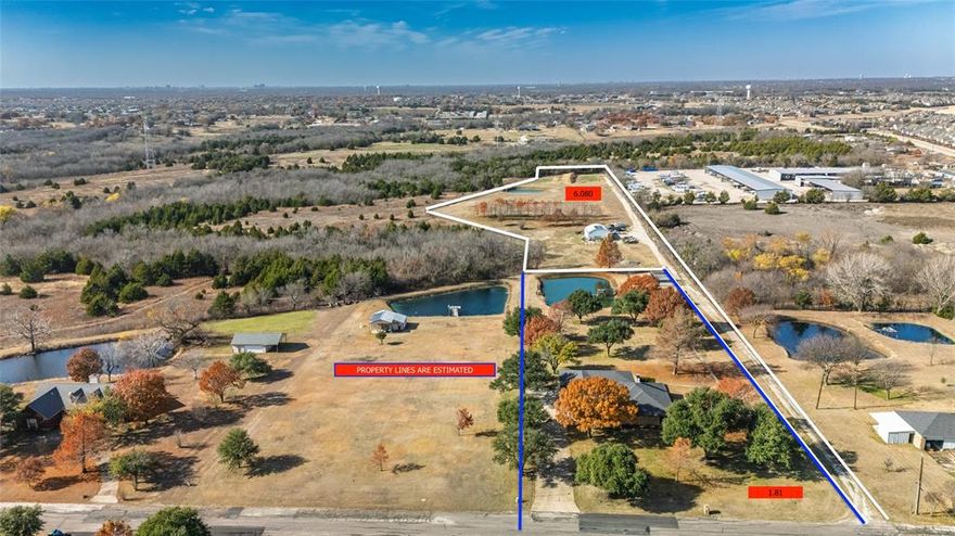 On 7.89 acres in sought-after Wylie ISD is where you'll find this brick 3 bedroom, 2.5 bath house! Live in the city while feeling like the country with a bonus of having access to Lake Lavon, Collin Park Marina, and Trinity Trails. Enjoy a quiet cul-de-sac subdivision with no HOA and your own land with 2 ponds, one coming with a pier. Inside, find plenty of room with 3 living areas including an extra-large enclosed sunroom with a wall of windows to the private backyard. Stay cozy on cold winter nights with a wood-burning fireplace in the central living room. The kitchen includes a cooktop, double ovens, dishwasher, stainless steel appliances, built-in desk with glass overhead cabinets, and a breakfast bar. Two dining areas give you room to spread out for family or friend gatherings and meals. A spacious primary ensuite comes with ceiling fan, double sinks, and separate tub and shower. The laundry room has room for 2 refrigerators or freezers. Additional perks are: new glass in windows, spray foam in the attic, variable speed heat pump, dehumidifier, and electricity to pond sprinkler. Keep the lawn green with the full-lawn sprinkler system. You'll also find a great fenced garden spot with automatic sprinklers from the pond and a covered area for plants. Take advantage of the solar-powered 36x32  that can used as a shop, storage, hobby space, or etc. Sit outside and watch the wildlife, including an abundance of deer. Feel like you are living in the country, just minutes from Wylie, Lucas, and St. Paul!
