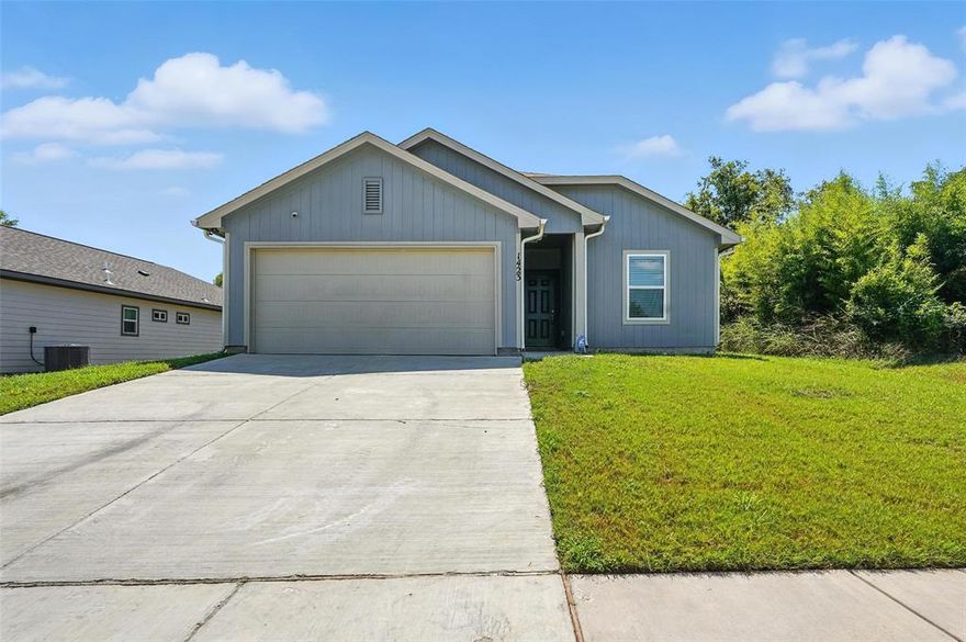Beautiful 2023 build CORNER LOT in Greenville, Tx! Rare at this price point to get a newer build WITH a 2 car GARAGE! Open concept floor-plan greets you upon arrival! Beautiful white Kitchen featuring granite c-tops, white cabinets, and spacious ISLAND. Perfect for entertaining! Good-sized Primary Bedroom with adjoining on-suite bath. Both guest bedrooms are a good size! Schedule a showing today!
