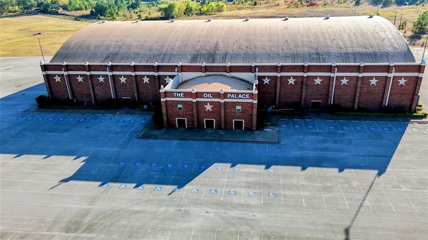 Discover a rare opportunity to own one of East Texas most iconic entertainment venues in Tyler, TX it is a massive 44-acre propertyfeaturing a 60,000 sq ft arena with seating for 7,000-9,000 and stands as the only venue of its size within 90 miles — ideal for concerts,sporting events, trade shows, circuses, large-scale banquets, or redevelopment. The sale includes all of the original operating equipmentincluding stages, tables, chairs, bleachers, concert speakers, audio equipment, lighting, kitchen equipment, fridges, freezers, cashregisters, fork lift, floor polishers, mower, bucket lift, couches, lounge chairs, office furniture, grills, portable beverage coolers, pressurewasher, paint sprayer, tools, and so much more. The facility boasts a 60,000 sq ft clear-span show floor, 38-ft high ceilings, retractable seating, full commercial kitchen & concession infrastructure, multiple bars, 2 entertainer lounge buildings with amenities, workshop or storage building, and extensive parking — plus the kind of highway frontage and visibility that few properties can match. A renovation in 2018 modernized seating, roofing, and layout, this property offers a compelling opportunities for an investor. Use it as-is for concerts,rodeos, sporting events, monster-truck shows or community events — or reimagine the 44 acres for mixed-use expansion (hotel, RVpark, retail, residential, etc.). With so few venues of comparable scale in East Texas, this is a rare chance to own a landmark propertybrimming with legacy, potential, and flexibility. All equipment included should be verified by doing a UCC search prior to purchase and is not guaranteed to be owned by the Bank or Seller. Detailed information provided above has come from different website searches and is not 100% guaranteed accurate by the listing broker or Bank or Seller and should be verified prior to purchase.