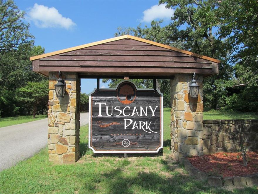 Beautiful, tree-covered lot in the sought-after Tuscany Park subdivision—one of Mineola’s premier communities. This picturesque property offers serene water views of the neighborhood’s stunning private lake and sits among well-maintained, upscale homes. With paved county roads and utilities conveniently located at the street, the lot has already been cleared of underbrush and is ready for you to build your dream home. Enjoy peaceful country living just minutes from shopping, historic downtown Mineola, charming restaurants, antique stores, and unique boutiques. Tuscany Park offers the perfect blend of natural beauty, privacy, and accessibility—an ideal setting for your next home.