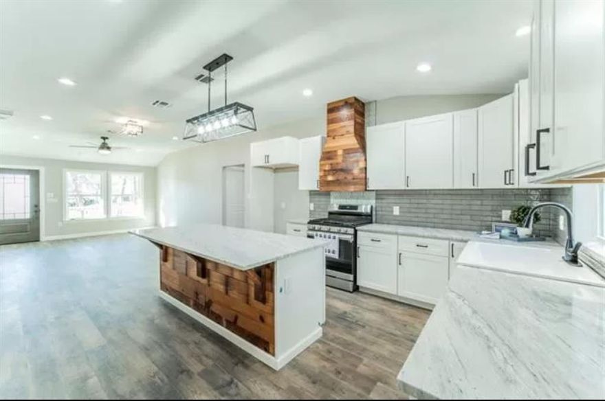 Modern, clean and sleek are the words to describe this beauty. Brand new inside and out! Gas tankless water heater, New refrigerator, dishwasher are your for the use.. This is a must see home. apps online at brgproperties