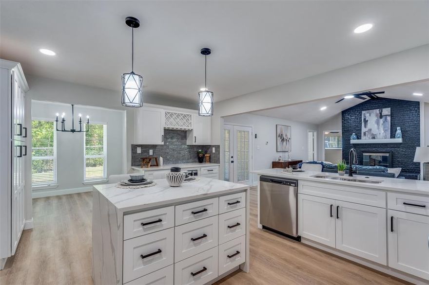 WANT TO LIVE CLOSE TO YOUR WORK AND LIFESTYLE? This STUNNER HOME with 150K worth of updates has is all and is easy to show! Near White Rock Trails and Scenic Greenbelt for the outdoor enthusiasts! This beautiful 4-bedroom with flex office, 3-bath, 2 car garage, with a circular dive ranch style that perfectly blends modern style with everyday convenience MINUTES FROM DOWNTOWN! Truly hard to find a MOVE IN READY in DALLAS with all updates you have been looking for! Home is close enough to the city, yet with a suburban feel! Ready for something fresh this home is designed for the way you live today. Step inside and experience an open, light-filled layout featuring luxury plank flooring, brand-new energy-efficient windows, and designer finishes throughout. At the heart of the home, the chef’s kitchen shines with quartz countertops, a generous island, shaker-style soft-close cabinetry, stainless steel appliances, and even a built-in wine rack, perfect for hosting friends and family. The private primary suite offers true retreat living with a spa-inspired bath, complete with dual handheld shower heads, and an oversized walk-in closet. Each secondary bedroom has its own beautifully updated bath, giving comfort and style to every guest. Step outside and discover not one but two covered patios overlooking a large corner lot, welcoming backyard for pets to safely run, play, and explore while you relax, garden, or entertain. No direct neighbors in front or behind. Upgrades include a tankless water heater, oversized laundry room, completed foundation work, and a spacious two-car garage all with no HOA. Nestled in one of Dallas established quiet neighborhoods within the sought-after Richardson ISD, this home offers convenience, just minutes from major corporations like Texas Instruments, Baylor Scott and White, Medical City, Dallas Lutheran School, North Park Mall. Quick access to 75 & 635 for an easy commute to downtown. YOU'LL FEEL RIGHT AT HOME FOR THE HOLIDAYS!