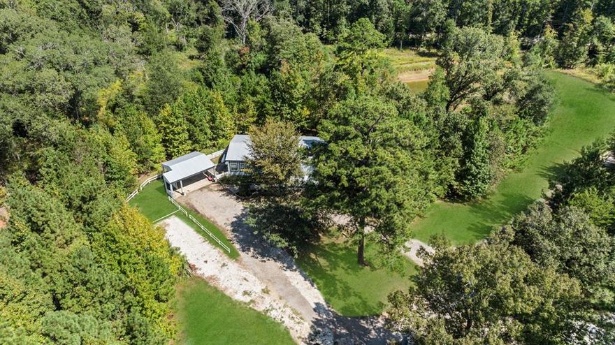 Multiple, gorgeous homes located on a 12.49-acre dream retreat, multi-generational living compound, or investment opportunity in beautiful Ben Wheeler!  This stunning property offers the perfect blend of natural beauty, modern comfort, and income potential. With 4 acres thoughtfully developed, the property includes a beautiful 1,800 sq ft home featuring new decking and flooring, a spacious layout, and an HVAC system less than two years old. A large two-car carport adds convenience for daily use or guest parking.
Two fully furnished 399 sq ft Athens Park tiny homes—complete down to the forks and spoons—offer exceptional short-term rental potential or ideal guest quarters. One home (white) is fully electric, while the other (blue) has propane capability, offering flexibility for future use. Both tiny homes, as well as all other structures on the property, feature durable metal roofs for long-lasting protection.
A large RV pad is also included, adding even more rental income potential or versatility for visitors. The property is dotted with mature trees, a peaceful pond, and a flowing creek at the rear—creating a serene and private setting. There are also wooded acres and an open clearing that would make a beautiful site for your forever home or prime spots for additional tiny homes or business ventures.
Whether you're looking to live, rent, host, or escape, this versatile property is packed with potential as a private residence, a vacation rental hub, or a retreat-style business in one of East Texas’s most charming small towns.
