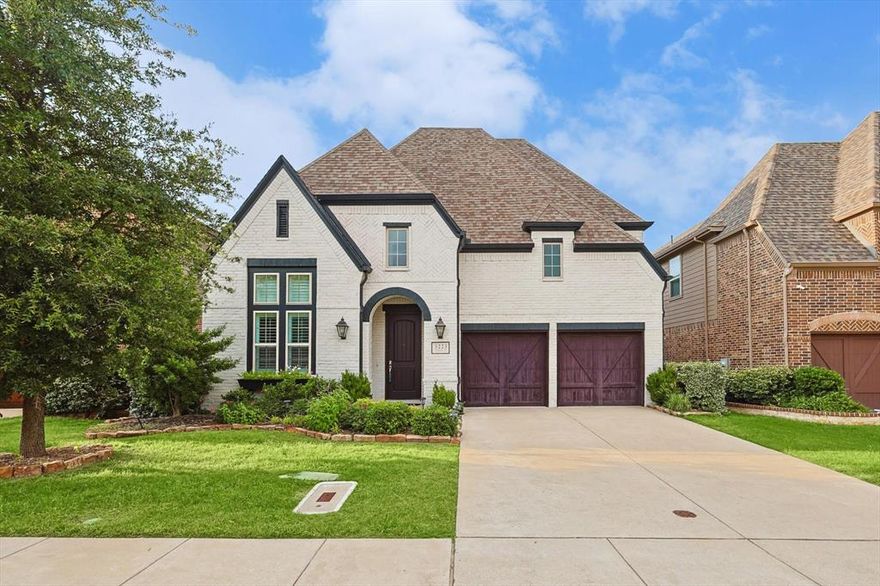 Experience luxurious living in this Highland Homes built gem in Irving. The spacious floor plan features a grand family room with vaulted ceilings and large windows that flood the space with natural light. The home includes a roomy office with built-in shelves and a formal dining room perfect for entertaining. The open kitchen is a chef's dream, with custom cabinetry and quartz countertops. Hand scraped hardwood floors add warmth and elegance to the downstairs living areas. Enjoy the convenience of two downstairs bedrooms and powder baths on each floor. Upstairs, find a game room and media room for entertainment. The backyard features a beautiful arbor and patio, perfect for relaxing and gardening. This home also offers solar panels and a fully planted organic garden ready for harvest at move in. Located in the highly sought after Coppell ISD. A must see!