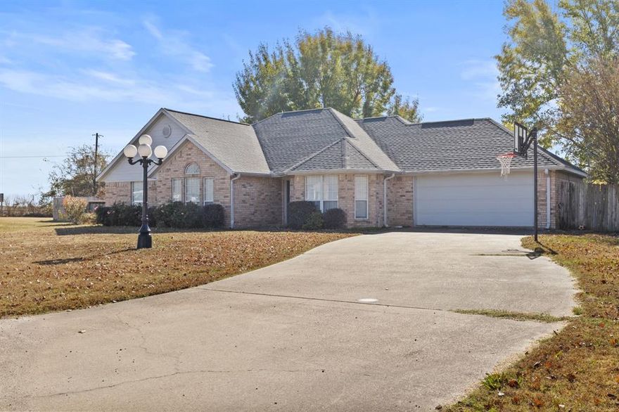 Nestled in the highly coveted Point North subdivision, this 4-bedroom, 2-bathroom home is a true gem! As you step inside, you are greeted by a spacious living area showcasing a stunning brick fireplace and ample natural light streaming through the large windows. Boasting over 2,000 square feet of living space, this home is an entertainer's dream! The chef's kitchen is a culinary enthusiast's delight, complete with a cozy eat-in dining area, plenty of storage space, and top-of-the-line stainless steel appliances. The primary suite is a luxurious oasis, featuring a private ensuite with a glass shower, a separate lavatory, and a generously sized walk-in closet. The garage has been transformed into a sizable bedroom, offering additional privacy and versatility. The well-appointed guest rooms share a stylish hall bath. Outside, the expansive lot offers a sprawling back porch, a privacy fence, and a workshop with electric, concrete flooring and attic storage, creating the ultimate outdoor retreat!