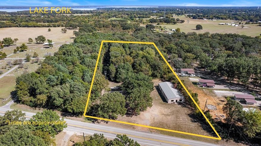 Just minutes from legendary Lake Fork, this 3.51-acre property at 1620 N FM 17 in Alba, TX offers the perfect blend of rustic charm and versatile opportunity—with no restrictions! Nestled among towering mature trees, the property features a cozy 1,200 sq ft log cabin and an impressive 3,200 sq ft commercial-style workshop and office space, making it ideal for a home-based business, rental investment, or private retreat. Step inside the 2-bedroom, 1.5-bath log cabin and enjoy warm wood tones throughout, a vaulted living room ceiling, decorative paneling, and an inviting eat-in kitchen with a window overlooking the wooded backyard. The cabin also features a large laundry room, a newer roof (July 2024), and a Comfort Maker HVAC system installed (Sept 2024) for peace of mind. The 1,400 sq ft insulated workshop with LED lights offers three oversized roll-up doors—perfect for vehicle storage, projects, or equipment—while the attached 1,800 sq ft office space has been updated with new laminate flooring, paint, lighting, and an AC system installed in July 2025. With no restrictions, you can truly make this property your own—bring your business, create a rental income stream, or enjoy your own private getaway near the lake. There’s plenty of space for RV parking, additional units, or future expansion.