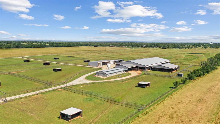 Turn-key horse operation at its absolute finest. Situated on a sprawling 163 acre parcel of land, this property offers ample space and countless opportunities for your horses and farm production. Multiple pastures, fully fenced & crossfenced. 12-stall barn with automatic waterers, fans, fly-spray system, and matted stalls. Enclosed feed room & separate tack room. Covered breezeway from the barn to arena. 120x225 covered arena, with flag system & removable panels. Covered area with 6-horse Trojan walker. 8-traps with 20x12 horse sheds with water to all pens & separate alleyways. Main house has 3 bedrooms 2.5 bathrooms. Open concept. Covered patios wrap around. From pasture to pasture, every location is properly maintained and ready to be used immediately. Approximately 163 acres fenced for horses or cattle. Overall, this property is a true gem, offering unparalleled space, beauty, & horse amenities.  All the necessary tools and farm equipment needed to operate the ranch will convey.  It is sure to impress and offers all the space and amenities you need to succeed.