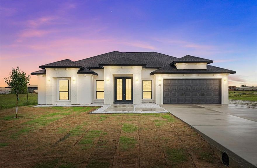 Builder promotion available for a limited time — builder to pay buyer’s closing costs. Discover modern luxury and everyday comfort in this beautifully designed stucco home located in the Victory Estates subdivision. With 2,351 sq. ft. of living space, this thoughtfully crafted residence offers 4 spacious bedrooms and 3 full bathrooms, perfectly suited for families or those who love to entertain in style.

Step inside to experience soaring 9 ft. ceilings throughout, and a stunning 12 ft. coffered ceiling in the living room that creates a bright, open, and elegant ambiance. 100% porcelain tile flooring flows seamlessly throughout the home, combining long-lasting durability with sleek, modern appeal.

At the heart of the home is a designer kitchen featuring a quartz island, accented by LED lighting in the island and cabinetry — a perfect space for cooking, gathering, and entertaining.

The master suite is your private retreat, complete with a spacious walk-in closet and a luxurious walk-in shower with a built-in bench for ultimate relaxation. The inviting living area also features an electric decorative fireplace and a built-in TV niche, making it as cozy as it is functional.

Enjoy the convenience of a double-door 2-car garage with a pass-through to the backyard — perfect for hosting gatherings, working on projects, or simply making everyday living easier. Situated on a 0.18-acre lot, this home offers both space and style in a peaceful, well-located neighborhood.