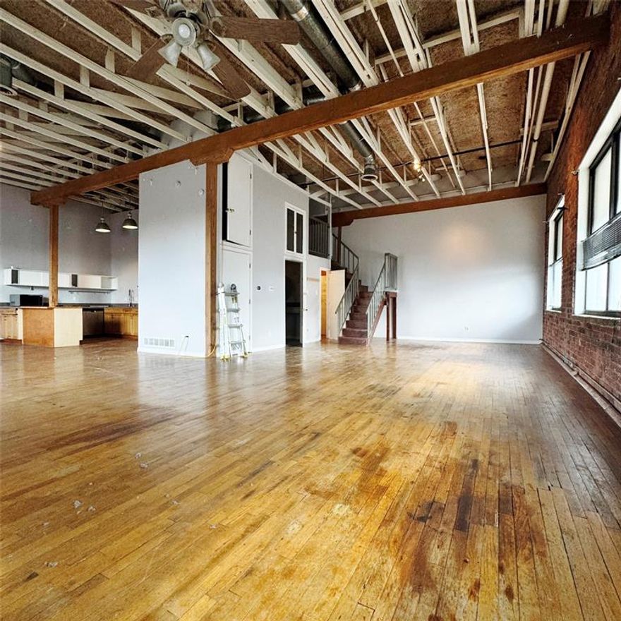 MOVE-IN SPECIAL! $500.00 OFF YOUR 2ND FULL MONTH'S RENT! Massive Dallas loft offers a floor plan that is 1466 sf on the main level and 210 sf in an upper level multi-purpose loft. This former mattress factory features include 17 foot ceilings, hardwood floors, exposed brick walls and huge windows offering stunning views of downtown and the surrounding Cedars neighborhood. Open kitchen features a gas range, dishwasher, disposal, and refrigerator. Relax your cares away in the luxurious full bath that includes a whirlpool, dual head shower and jetted tub. Full size utility area comes equipped with a washer dryer and lots of additional storage space. Lease includes 2 gated parking spots and two grassy areas available for your small pet, which may be approved on case by case basis. Only 1 pet allowed with owner approval.
