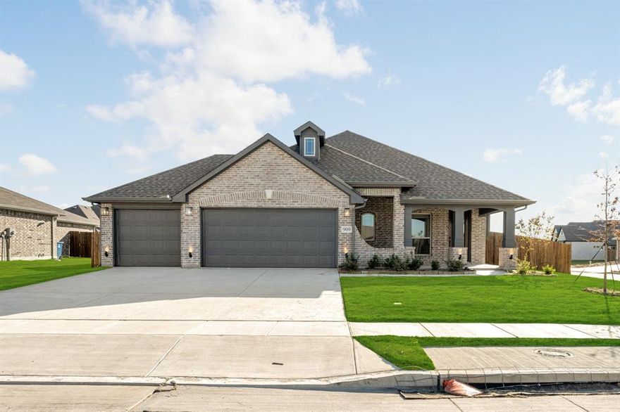 NEW! NEVER LIVED IN! READY NOW! The Dogwood by Bloomfield Homes delivers charm and functionality in a one-story layout that’s designed to impress from the very first glance. A 3-car garage, oversized covered porch, and brick exterior give the home striking curb appeal, while inside, you’re welcomed with a foyer that opens to a private study framed by elegant glass French doors. The heart of the home is the open-concept kitchen, dining, and family room—perfect for both everyday living and entertaining. The Deluxe Kitchen is loaded with upgrades, including quartz countertops, stainless steel appliances, a large center island, and custom cabinetry. Natural light pours through large windows, making the family room bright and inviting, while easy-care laminate flooring flows through the main traffic areas. This split-bedroom design offers comfort and privacy, with a spacious Primary Suite tucked away in the back featuring a walk-in closet and ensuite with dual vanities, separate shower, and garden tub. Outside, the home sits on a large corner lot with a landscaped yard, complete with stone-edged flower beds, a sprinkler system, and blinds included throughout for move-in convenience. A covered patio extends the living space outdoors, perfect for relaxing evenings or weekend cookouts. It’s a thoughtful blend of smart design, stylish finishes, and the extra space today’s families need—all wrapped up in one of Bloomfield’s most popular single-story plans.