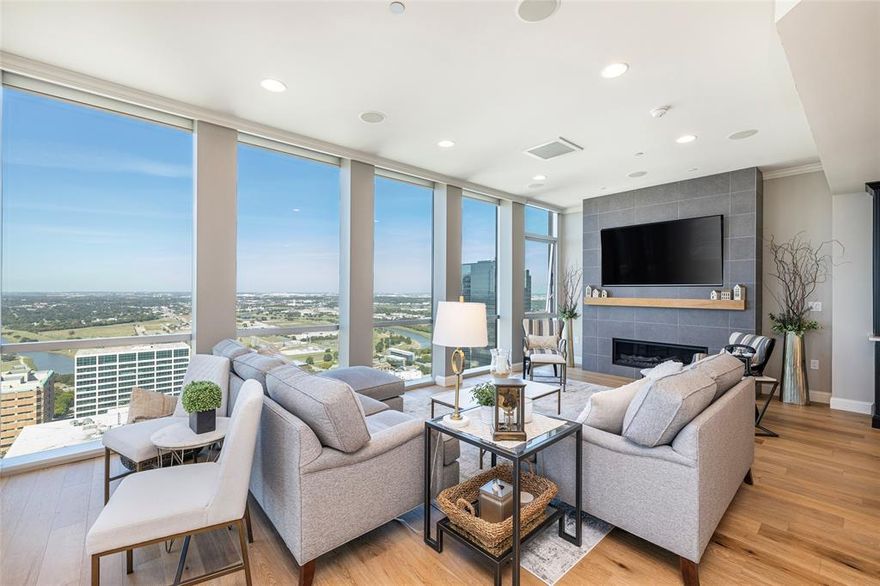 Truly Breathtaking.  A complete renovation has transformed this spacious lock and leave condominium into a stunning home that will welcome both family and guests.  Panoramic vistas from the floor to ceiling glass walls will mesmerize as you marvel at the sunsets, fireworks in July, Trinity River and one day, Panther Island, and City Lights as each day ends.  This one has 2 patios and 5 deeded parking spaces.  Important items to know are . . . the primary bath floor is heated, both the Kitchen and primary enjoy Touch faucets, there is a whole house water filtration system, the HVAC thermostats are wifi controlled, there are Lutron remote controlled wall mount window coverings, the three bedrooms each have black-out shades, there is surround sound in the central living space.  One of the HVAC systems has recently been replaced with Trane equipment.  A bonus is the entry and utility garage closets near the front of the home.  The dining room, wet bar and master bedroom have built-ins that are not only beautiful in appearance but add much needed and efficient storage.  Whether it is a holiday or every day, the warmth and beauty of this 32nd floor home will wrap you in lit's luxurious surroundings.