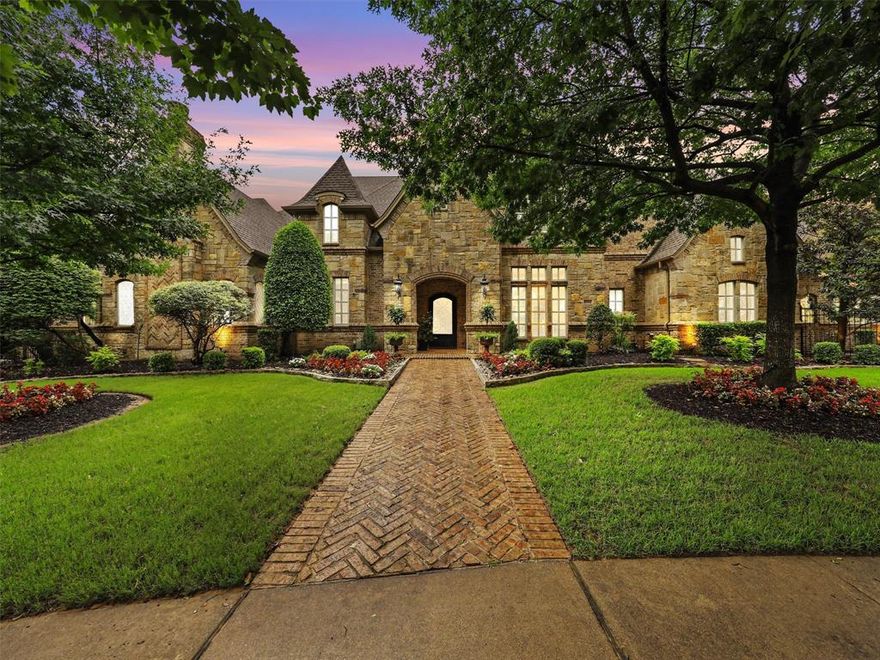 Nestled on nearly an acre of serene land, this exquisite 5-bedroom home offers the pinnacle of luxury living. Situated on a peaceful cul-de-sac and backing up to a lush greenbelt, tranquility abounds in this idyllic setting. Boasting a remarkable 7-car garage, this property is a car enthusiast's dream. Step outside to discover a resort-style pool complete with a beach entry and enchanting grotto, perfect for relaxing or entertaining guests. Enjoy endless fun on the half-court sport court, or indulge in culinary delights in the loaded outdoor kitchen featuring top-of-the-line Lynx grills, refrigerator drawers, and an ice maker. Additional outdoor amenities include a pool bath with an outdoor shower and mosquito misters, ensuring comfort and convenience year-round. Located in the prestigious Carroll ISD, this home offers the epitome of luxury living coupled with unparalleled privacy.