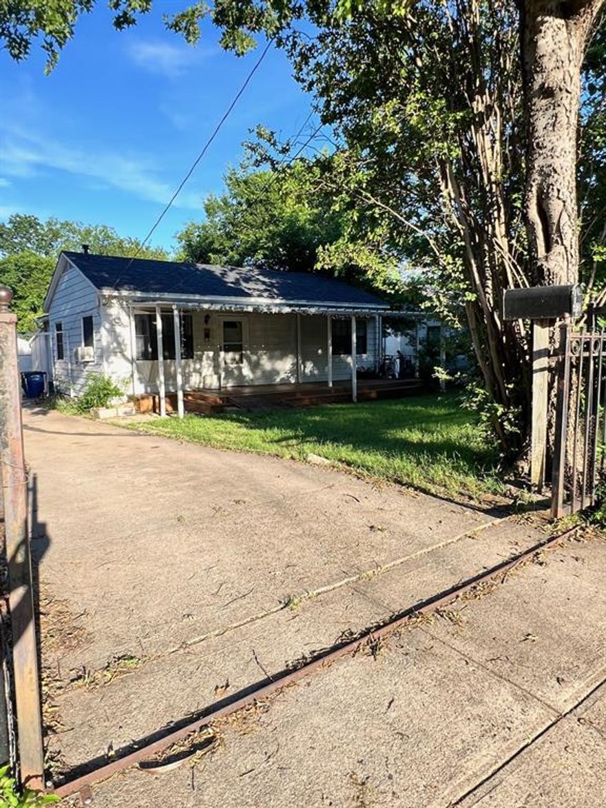 This 1943-built home offers one of the larger footprints in the area and presents a strong opportunity for investors or buyers looking to add value. With 1,067 sq. ft. plus an ADDITIONAL approximate 402 sq. ft. bonus space, the home provides significantly more usable flexibility than the listed square footage suggests.

The layout has previously functioned as a 4-bedroom and is currently listed as a 3-bedroom due to the 402 sqft. rear bonus room not meeting living area requirements because it lacks a permanent heat source.

Location is a standout—just one block from Martin Weiss Park and approximately 4 miles from the highly sought-after Bishop Arts District, offering strong long-term appeal for both rental and resale potential.

Additional features include a roof approximately 3 years old, a large front deck, and a manual wrought iron sliding front gate. Please note, the home has never had central HVAC.

This property is best suited for a buyer with vision and creativity, ready to maximize space and capitalize on a prime location.