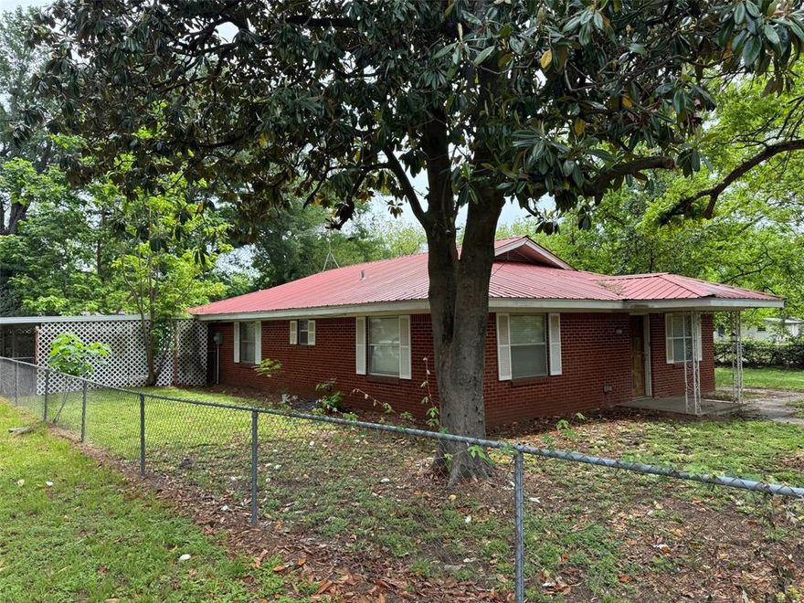 This charming 3-bedroom, 2 full bath brick home offers 1,716 square feet of living space and is full of potential for the right buyer. Built in 1960, the property showcases solid construction and timeless character, providing an excellent foundation for updates and personalization.

Inside, you’ll find a nice layout with generously sized bedrooms and living areas ready to be reimagined to suit modern living. The home’s classic design makes it an ideal canvas for renovations, whether you're looking to restore its original charm or create a more contemporary space.

Outside, the large carport offers convenient covered parking and additional storage options. The property sits on a sizable lot, giving you room to 
expand, landscape, or create your own outdoor retreat.

Schedule your showing today and explore the possibilities!

THIS HOME IS SOLD AS IS
