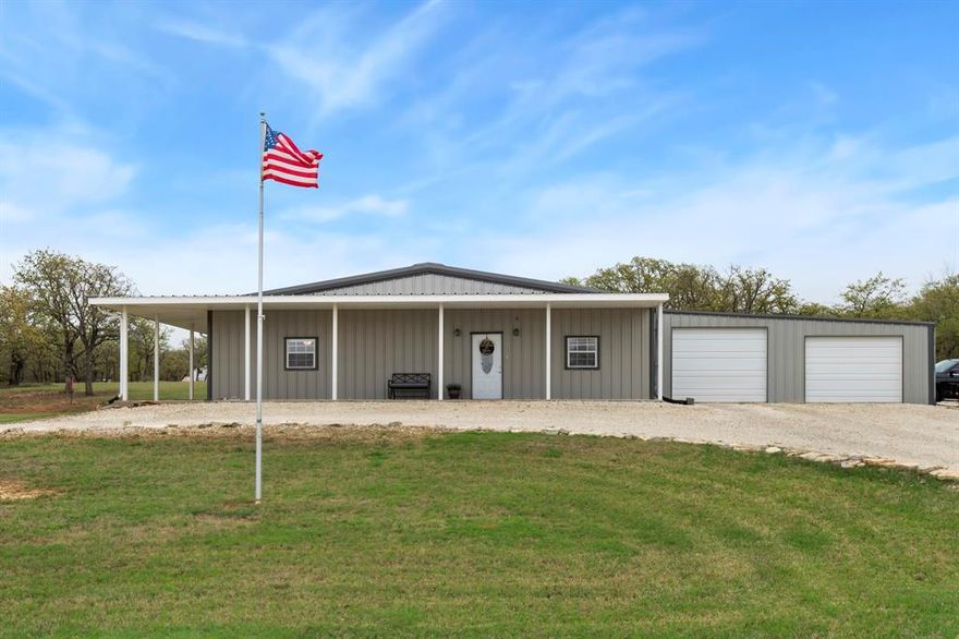 Looking for a quiet place to settle down? This recently constructed barndominium offers peace, quiet, and modern comfort. Situated on a corner lot, the property provides access from two streets, ensuring easy access. Located within a gated community with 24-hour guarded entry, this home offers security and access to a host of amenities, including golfing, fishing, camping, and a country club coming soon. Completed in 2022, the home was thoughtfully designed to maximize every square foot. The spacious open-concept layout is perfect for entertaining, while the covered back porch offers a tranquil spot to enjoy your mornings watching deer graze. From the front porch, you’ll enjoy picturesque views of a nearby pond, creating a relaxing atmosphere. The home features well-sized bedrooms and closets for comfortable living. Additionally, the two extra lots provide added privacy and space to make this property truly your own. This home also features worry free updates such as a tankless water heater, RV hook ups, 30x30 attached garage and a beautiful water view on your front wrap around porch.  Don’t miss out on this unique opportunity! Short-Term Lease investors are welcome… This would be a great opportunity.