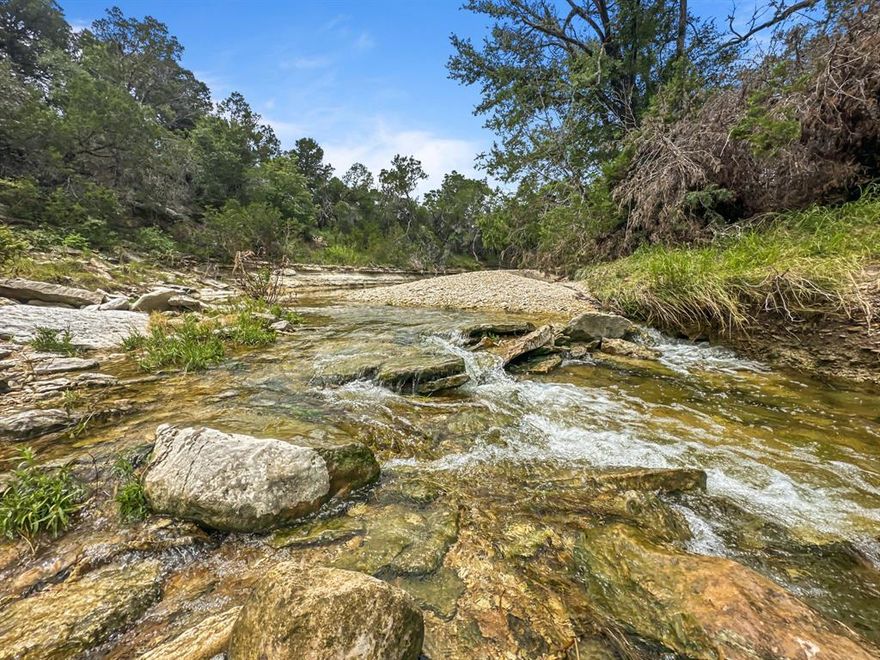 Partridge Creek Legacy Ranch Remarkably in the same family since 1940.
288.09 acres of breathtaking Texas landscape, where the dramatic beauty of the land takes center stage. A defining feature of this remarkable property is the mile-plus stretch of Partridge Creek, which meanders through the entire ranch, adorned with numerous picturesque rock overhangs and a clear, rock-lined bottom. The terrain itself is an adventure, boasting 120 feet of significant elevation changes that provide expansive views and varied natural settings. Everywhere you look, tons of beautiful, mature oak trees stand as ancient sentinels, creating a rich, forested environment and great cover for abundant wildlife, including deer, turkey, hogs, and dove. This is a rare opportunity to acquire a substantial tract of land celebrated for its vibrant live water, unique geological formations, and stunning natural woodlands—a true legacy property awaiting its next steward.

This property also includes:

Water well: Provides a reliable, independent water source.

Cooperative power: Reliable electricity service from a local co-op.

Cattle pens: Existing infrastructure for livestock management.

All owned minerals will convey