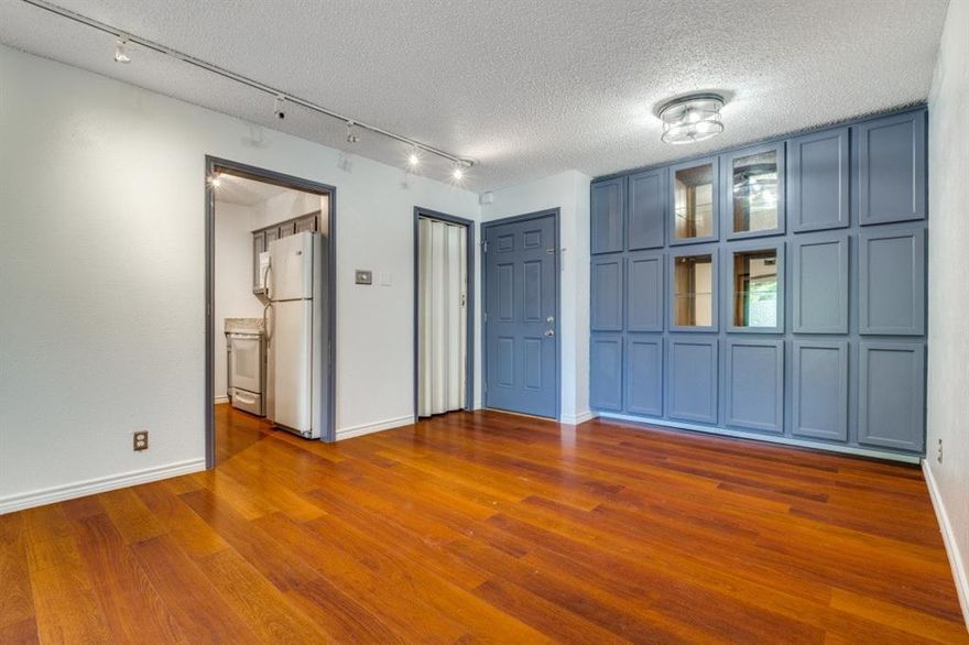 GREAT NEW PRICE, GREAT LOCATION, and MOVE IN READY!! Wonderful view of Cedar Creek and greenbelt. Breezeway entrance. This updated second floor unit features large open living area with wall of built ins and decorative lighting; kitchen with granite counters, pantry and refrigerator; two bedrooms with generously sized walk-in closets and hall bath. Laundry center close to the unit. Community pool and gated complex. Easy access to Dallas Tollway, minutes to Love Field, Downtown and Katy Trail.