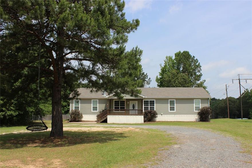You are guaranteed to fall in love with this Minden home! It sits on Over 2 acres, so you feel secluded, with a good sized front and backyard. Prime location just a few miles from Wal-Mart, in a country setting! You won't find another 4 bedroom home, this clean and roomy, for Under 200k! Nice driveway with a hidden carport, that's really cool. Nice, large front and back porches, and fully fenced in backyard! The inside has been updated, and it's Ready for you to move your things in! New flooring and the Roof is under 5 years old. Remote primary bedroom with huge Bathroom, and walk in closet! It offers a spacious kitchen with an island, and plenty of cabinets and drawers for storage. Stainless steel appliances,  Nice sized pantry, and a full size utility room. It also offers Optimum high speed interenet! Don't miss out on this rare opportunity, schedule your showing with your favorite Realtor, immediately!