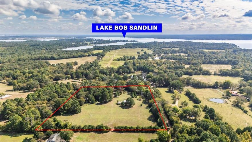 Looking for space, privacy, and flexibility near Lake Bob Sandlin? This 9.308-acre property near Mt. Vernon, TX offers just that—with two homes already in place! The main home is a classic 3 bed, 1.5 bath brick house built in 1966. It includes a fireplace, updates, full of character, and ready for your personal touch. The second home is a 2 bed, 2 bath manufactured home with open floor plan—ideal for extended family, guests, or rental income.The land is a beautiful mix of open pasture and mature trees, perfect for gardening, animals, or just enjoying the peace and quiet. There's even a small pond tucked in the woods, adding to the property's charm. Located in Mt. Pleasant ISD, you're 5 minutes to Lake Bob Sandlin State Park, 7 minutes to a public boat ramp at Lake Bob Sandlin, and minutes from Lake Cypress Springs—making this spot ideal for nature lovers, weekenders, or full-time living.You can live in one house and use the other for rental income, or rent out both, or use as a B-n-B. Whether you're dreaming of a homestead, a family compound, or an investment property, this one has the space and potential to make it happen.