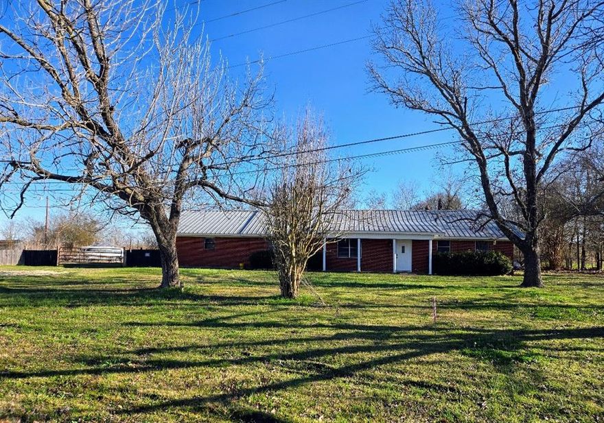 Looking for a peaceful country setting? This ranch style home with its spacious rooms is it! The home sits on the edge of town on a large lot so you don't have to worry about reaching out and touching your neighbor. You have plenty of space to feel secluded, but you are not too far out in the country, it is the best of both worlds. All of the rooms are oversized compared to today's standards for sure. There are built in shelves in the primary bedroom and hallway and a lighted nook in the primary suite which could be a computer cove or a nice spot to have a vanity for getting ready in the mornings. The garage has been partially converted to a room but could easily be converted back to a garage. With just a few minor cosmetic repairs and touch ups this home could really sparkle and shine. If you are in the market for a home that you can move right into but want something that you can put your stamp on and create your own personal retreat and oasis this home will provide you with that opportunity. ***THIS IS AN AUCTION, PLEASE SUBMIT ALL OFFERS THROUGH THE PROPERTYS LISTING PAGE, SEE PRIVATE REMARKS FOR LISTING PAGE***