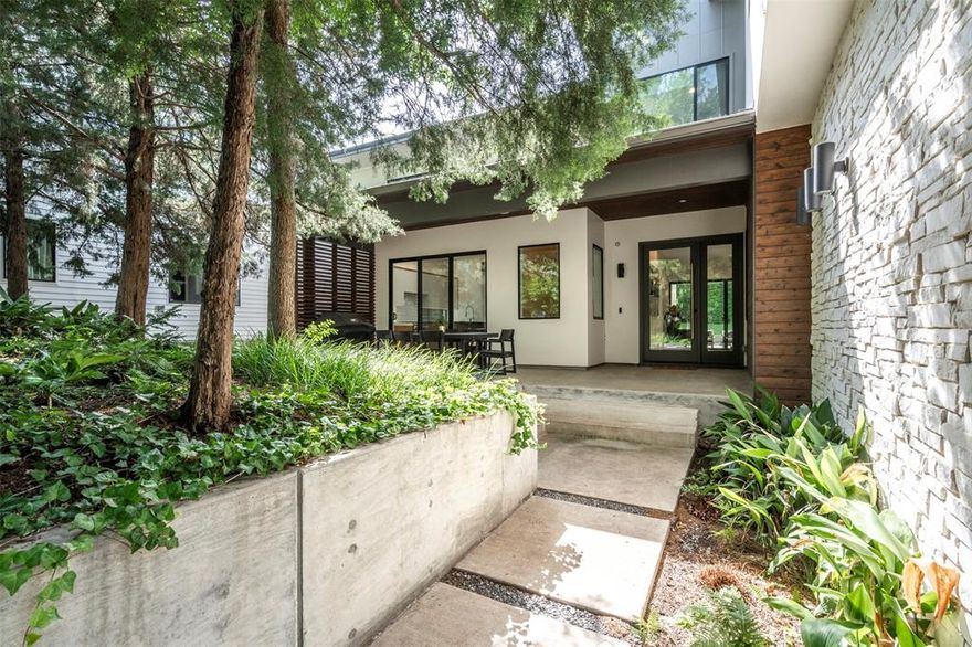 Welcome to 8020 Forest Trail, a beautifully designed 5-bedroom home located in one of Dallas’s most desirable neighborhoods served by White Rock Elementary. The primary bedroom is on the first floor, offering convenience and privacy. A second bedroom downstairs is currently set up as a home office, providing flexibility for various needs.

The home sits on a lot that offers rare privacy, surrounded by mature trees that create a peaceful, secluded atmosphere. Its placement makes you feel miles away from the city while being right in the heart of Dallas. You’re also just minutes from Flag Pole Hill and White Rock Lake, providing easy access to outdoor activities.

The backyard is built for relaxation and entertainment, featuring a pool, hot tub, spacious lawn, and a covered patio with phantom screens for year-round enjoyment.  Smart lighting throughout the home adds to the modern convenience, and the two-car garage is equipped with an electric charger. The front yard also features a firepit and sitting area, ideal for gathering with friends and family.

Upstairs, a game room offers additional living space to meet your family’s needs. With quality finishes, thoughtful design, and a prime location