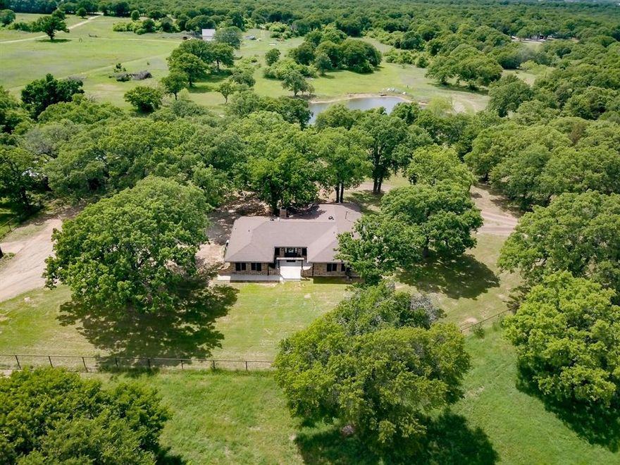 WELCOME TO 151 PRIVATE ROAD 1989, CHICO, TX 76431*COUNTRY LIVING AT ITS FINEST! THIS LOVELY ONE STORY HOME HAS BEEN REMODELED FROM TOP TO BOTTOM, DOWN TO THE STUDS! THE EFFECTIVE DATE IS APRIL 2026*THE RENOVATIONS WERE JUST RECENTLY COMPLETED*BRING YOUR ANIMALS, HORSES, CHICKENS, GOAT, SHEEP ETC*LOCATED ON 9.79 HEAVILY WOODED ACRES, WITH A 4 STALL BARN AND TACK ROOM PLUS 30 X 40 SHOP*PIPE FENCING INSTALLED WHICH COSTS APPROXIMATELY $100 FOR 8 FEET OF PIPE FENCING PLUS INSTALLATION- A LOT OF MONEY IN FENCING! THERE IS ALSO 5 STRAND AND BARBED WIRE FENCING*THE PROPERTY IS CROSS FENCED WITH A PADDOCK IN FRONT* ENTERTAIN YOUR FAMILY AND FRIENDS ON THE 18 X 12 PATIO AREA & PERGOLA*SANDY SOIL, GREAT FOR HORSES*WELL PUMP REPLACED 2 YEARS AGO*BRICK CONSTRUCTION*RV & BOAT PARKING*NO AG EXEMPTION CURRENTLY, NEW OWNER COULD APPLY, BAILING HAY WOULD QUALIFY FOR EXEMPTION*NO DEED RESTRICTIONS*STANDARD SEPTIC SYSTEM-PUMPED SEPT 2025*LOCATED OUTSIDE CITY LIMITS*HOME  HAS 3 BEDROOMS, 2.5 BATHS, 1 LIVING, 2 CAR GARAGE*FOOT IS 1835 SQ FEET*SOME WINDOWS REPLACED*BOTH UPDATED FULL BATHS HAVE ONE TOUCH LED LIGHTED MIRRORS WITH ANTI FOG FEATURE*UPDATED KITCHEN IS EQUIPPED WITH STAINLESS APPLIANCES, 42 INCH CABINETRY WITH SOFT CLOSE, COFFE BAR AREA, WHITE SUBWAY STYLE BACKSPLASH, GRANITE COUNTERS, BREAKFAST BAR, APPLIANCE GARAGE AND 2 SECTION COMPOSITE SINK*ENGINEERED HARDWOODS THROUGHOUT MUCH OF HOME*DINING AND LIVING ARE ADJACENT TO KITCHEN*A COZY FIREPLACE WITH STACKED STONE IS THE FOCAL POINT OF THE FAMILY ROOM WITH DOUBLE DOORS TO THE PATIO*WOOD ACCENT BEAMS ARE ON THE FAMILY ROOM CEILING*THE MUD ROOM,UTILITY ROOM AND HALF BATH ARE LOCATED CLOSE TO THE 21 X 19  GARAGE*VA ASSUMABLE NOTE WITH ASSUMABLE BALANCE OF $260K*NO SURVEY AVAILABLE*JUNPER TITLE WILL SEND NOTARY AT NO CHARGE TO BUYER*SEE AMENITIES & FEATURES LIST, 360 TOUR, FLOOR PLAN, AERIALS AND DRONE VIDEO ON NTREIS*