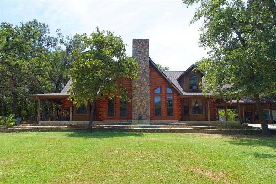 Welcome to your dream log cabin — a warm and inviting 2-story retreat that beautifully blends rustic charm with modern comfort. This stunning 4-bedroom, 4-bathroom home offers the perfect escape, featuring gorgeous woodwork throughout and thoughtful design in every corner.

Step into the spacious living room and take in the cathedral ceiling, anchored by a striking stone fireplace — the heart of the home and a cozy gathering spot year-round. 
Upstairs, a loft with skylights overlooks the living room, filling the space with natural light and offering a perfect reading nook or creative workspace.

Three of the four bedrooms feature private en suite bathrooms, providing comfort and privacy for family and guests alike. 
The kitchen is both functional and stylish, complete with a breakfast bar ideal for casual meals and entertaining.

Enjoy peaceful mornings or relaxing evenings on the large porch, where you can take in the tranquil setting and the beauty of nature all around.

This log cabin is more than a home — it’s a lifestyle. Whether you're looking for a permanent residence, vacation getaway, or investment property, this one-of-a-kind retreat is sure to impress.

Nortex fiber optic recently installed!