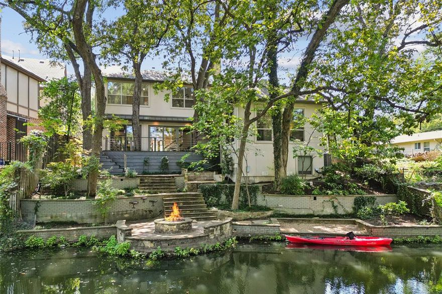 This soft contemporary lakeside retreat is located in a beautifully treed setting with terraced grounds backing to a private lake located in the heart of Lakewood providing an opportunity to own a truly unique property like few others in Dallas.  The home, with refreshed interiors featuring new paint, carpet and refinished quarter-sawn oak floors, offers approximately 4,000 square feet of living space including 4 bedrooms, 3.1 baths, formal dining, gameroom, media room and an office space with built-in desks perfect for studying or conducting business.  The heart of the home is the open concept living space with a fireplace, breakfast area and  a gourmet kitchen featuring stunning stone counters, Wolf range, SubZero built-in refrigerator and wine storage all overlooking the spectacular and verdant outdoors through walls of glass.  The generous primary suite located on the first level is an owner’s treehouse-like sanctuary with amazing views of the private lake and lush greenery.  The primary bath offers a large shower, jetted tub and stone finishes along with a natural light-filled closet.  This home offers the opportunity to experience tranquil private lakeside living in the middle of Dallas.