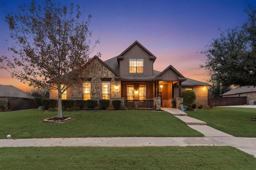 Covered front porch, 3-car garage, first-floor primary suite, and an oversized backyard with room for a pool make this beautifully designed 4-bedroom, 3-bath home ideal for both everyday living and entertaining. Set on a spacious .35-acre lot, the home welcomes you inside to an open-concept, light-filled layout featuring rich tile-wood flooring and a spacious living area anchored by a striking stone fireplace with gas logs.

The kitchen serves as the heart of the home, offering granite countertops, a large island with breakfast bar seating, stainless steel appliances, an electric cooktop, and a generous walk-in pantry—perfect for hosting gatherings or enjoying everyday meals at home.

A private study near the entry provides an ideal work-from-home space. The first-floor primary suite offers a relaxing retreat with dual vanities, a soaking tub, separate shower, and an oversized walk-in closet with convenient access to the laundry room. A secondary bedroom on the main level adds flexibility for guests or multigenerational living.

Upstairs, two additional bedrooms and a spacious game room create the perfect setting for movie nights, play space, or a second living area.

Step outside to enjoy the expansive backyard and covered patio—ideal for weekend barbecues, outdoor entertaining, or simply relaxing under the Texas sky. A mudroom and three-car garage complete this thoughtfully designed home, offering practical storage and everyday convenience.