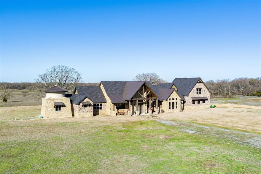 2-story brick home built in 2020 has everything you could want 3200 square feet first floor & 610 square feet second floor. Large foyer, living, dining all connected for an amazing open floor plan. Living room has a floor to ceiling stone wood-burning fireplace with custom wood mantle & stone hearth. There are plenty of windows along the east wall to let in natural light & wood look concrete floors for a warm and inviting feeling. Eat-in kitchen has beautifully placed island with knotty alder cabinets & granite countertops and has slate stainless appliances including a gas range that will convey. Primary bedroom has vaulted ceilings & an ensuite bathroom which has a walk around private shower, dual sinks, separate walk-in closets & a garden tub. Guest bedrooms have stained concrete floors, windows for natural light & nice size closets.  There is a reading room attached to the primary, wet bar, and a coffee station! The home is a complete custom home, with ample amounts of antique wood!